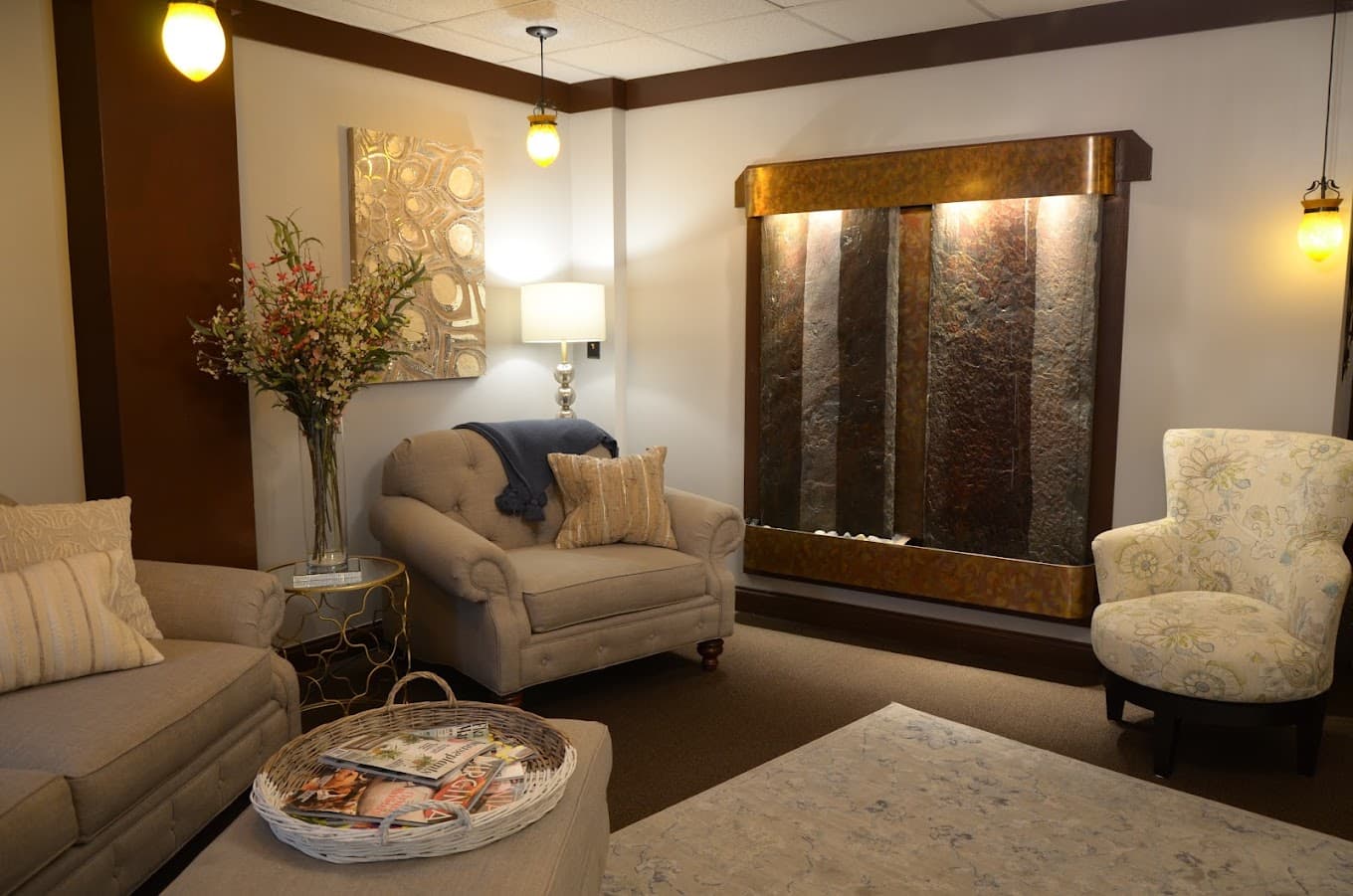 The relaxation lounge at Spa 4109, with its copper water wall and soft seating